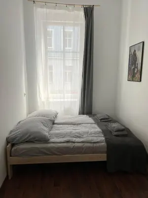 Łóżko lub łóżka w pokoju w obiekcie Śródmieście 2