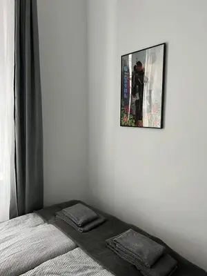 Łóżko lub łóżka w pokoju w obiekcie Śródmieście 2