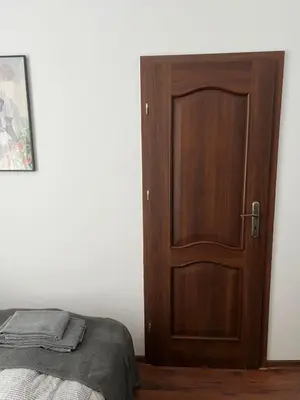Łóżko lub łóżka w pokoju w obiekcie Śródmieście 2