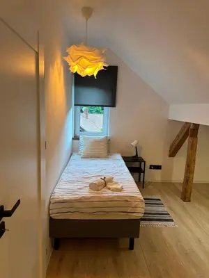 Łóżko lub łóżka w pokoju w obiekcie Apartament Sanatoryjna