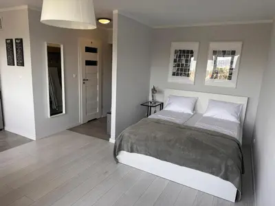 Łóżko lub łóżka w pokoju w obiekcie APARTAMENT OS ZŁOTE 5d