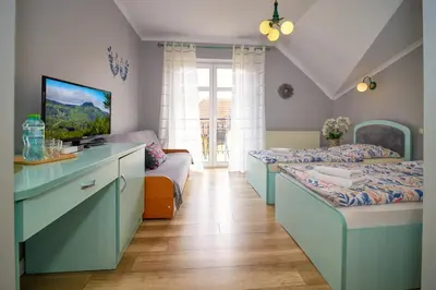 Łóżko lub łóżka w pokoju w obiekcie Villa Polka