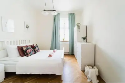 Łóżko lub łóżka w pokoju w obiekcie Duże mieszkanie w samym Rynku