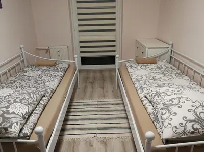 Łóżko lub łóżka w pokoju w obiekcie Spokojne w samym centrum