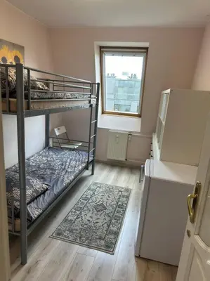 Łóżko lub łóżka w pokoju w obiekcie Spokojne w samym centrum