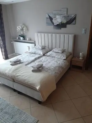 Łóżko lub łóżka w pokoju w obiekcie Pokoje Gościnne U ANI