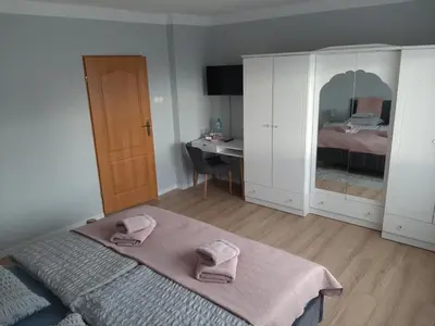 Łóżko lub łóżka w pokoju w obiekcie Pokoje Gościnne U ANI