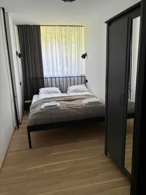 Łóżko lub łóżka w pokoju w obiekcie Loft Apartment Polanica Zdrój