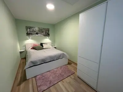 Łóżko lub łóżka w pokoju w obiekcie Apartament Pastelowy