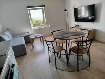 Telewizja i/lub zestaw kina domowego w obiekcie Apartament Eden