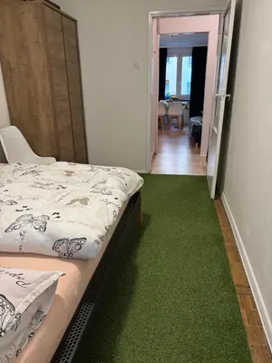 Łóżko lub łóżka w pokoju w obiekcie Apartament Joanna