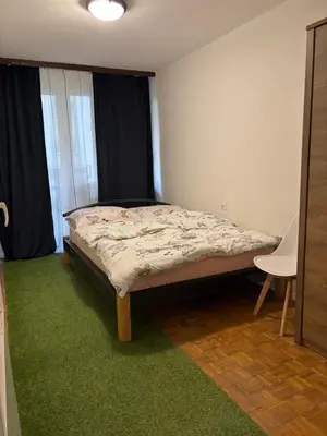 Łóżko lub łóżka w pokoju w obiekcie Apartament Joanna