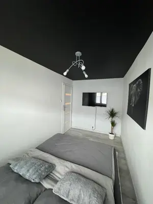 Łóżko lub łóżka w pokoju w obiekcie Apartament NOWE MIASTO