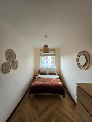 Łóżko lub łóżka w pokoju w obiekcie Apartament Zielone Łąki