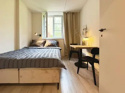 Łóżko lub łóżka w pokoju w obiekcie Natural apartment in the City Center - Old Town