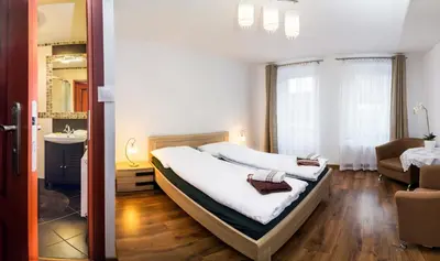 Łóżko lub łóżka w pokoju w obiekcie Willa Dorotka
