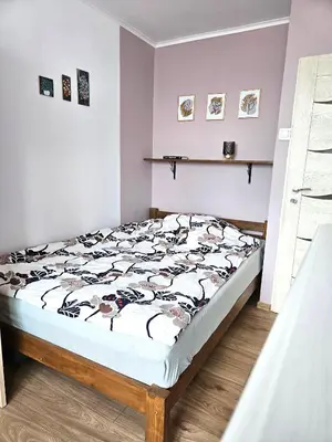 Łóżko lub łóżka w pokoju w obiekcie Apartament Błękitny Horyzont, Klimatyzacja
