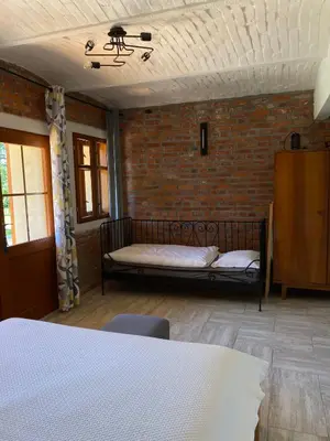 Łóżko lub łóżka w pokoju w obiekcie Agroturystyka Borów