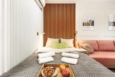 Łóżko lub łóżka w pokoju w obiekcie Luksusowe apartamenty przy Rynku