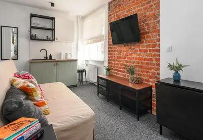 Telewizja i/lub zestaw kina domowego w obiekcie Patro Apartament 1 Wrocław Centrum
