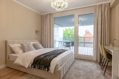 Łóżko lub łóżka w pokoju w obiekcie Apartament z tarasem Otyńska 4 - ProperUNIT