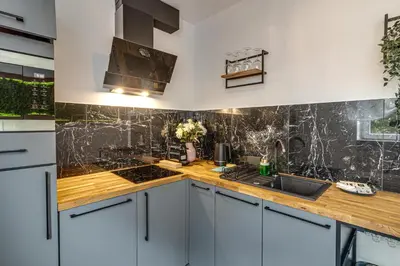 Kuchnia lub aneks kuchenny w obiekcie RentPlanet - Apartament Kościuszki