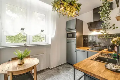 Kuchnia lub aneks kuchenny w obiekcie RentPlanet - Apartament Kościuszki