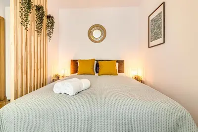 Łóżko lub łóżka w pokoju w obiekcie RentPlanet - Apartament Kościuszki