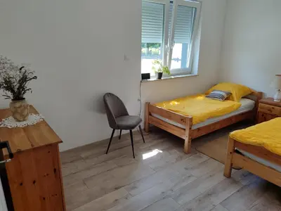 Łóżko lub łóżka w pokoju w obiekcie Apartament przy przystani