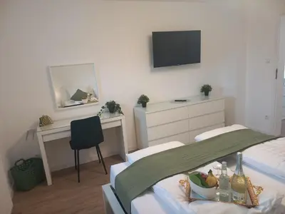Telewizja i/lub zestaw kina domowego w obiekcie Cityhouse Lubliniec Modern holiday residence for business and family stays