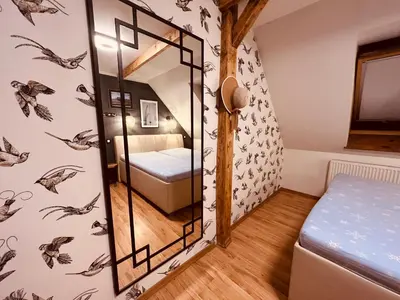 Łóżko lub łóżka w pokoju w obiekcie Apartament dwupoziomowy BALI