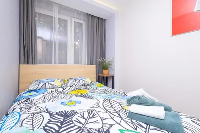 Łóżko lub łóżka w pokoju w obiekcie ALABAS - Stylish Central Apartment Check In 24h - Steps from Market Square & River