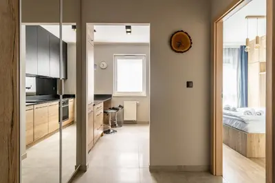Łóżko lub łóżka w pokoju w obiekcie RentPlanet - Apartament Małopanewska