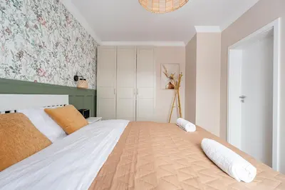 Łóżko lub łóżka w pokoju w obiekcie Apartament Oliwny 34 - balkon z widokiem na góry
