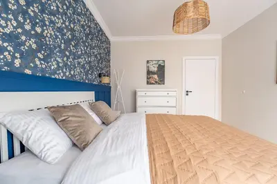 Łóżko lub łóżka w pokoju w obiekcie Apartament Szafirowy 40 - z dużym tarasem