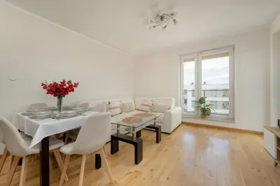 Część wypoczynkowa w obiekcie Exceptional Apartment with Parking for 6 Guests by Noclegi Renters