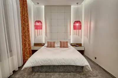 Łóżko lub łóżka w pokoju w obiekcie Hotel Kamieniczka