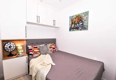Łóżko lub łóżka w pokoju w obiekcie Odkryj Serce Wrocławia