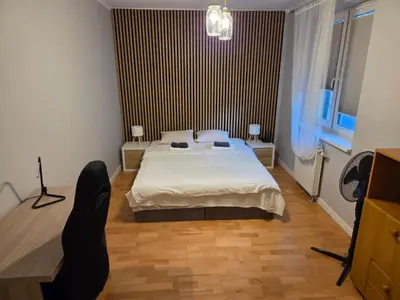 Łóżko lub łóżka w pokoju w obiekcie Zamieszkaj w Sercu Wrocławia
