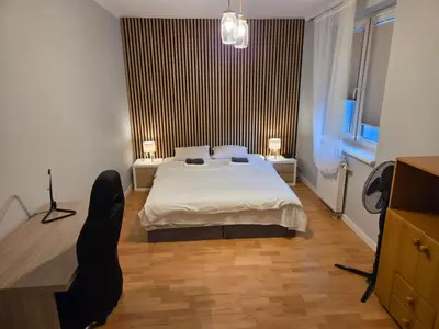 Łóżko lub łóżka w pokoju w obiekcie Zamieszkaj w Sercu Wrocławia