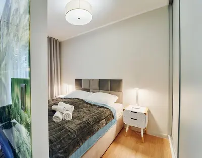 Łóżko lub łóżka w pokoju w obiekcie LAGUNA Apartament Polanica Residence 23 Przytulny z klimatyzacją