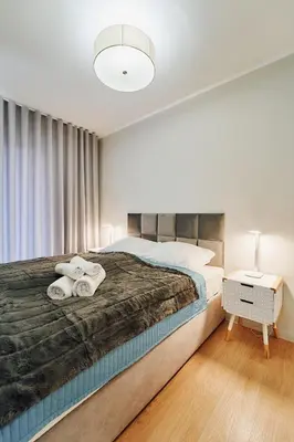Łóżko lub łóżka w pokoju w obiekcie LAGUNA Apartament Polanica Residence 23 Przytulny z klimatyzacją