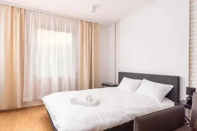Łóżko lub łóżka w pokoju w obiekcie Rynek Wrocław Deluxe Studio by BookingHost
