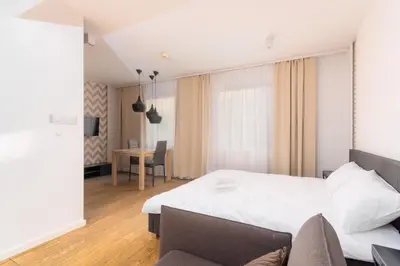 Łóżko lub łóżka w pokoju w obiekcie Rynek Wrocław Deluxe Studio by BookingHost