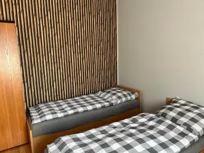 Łóżko lub łóżka w pokoju w obiekcie Tanie Noclegi Puszkina 6