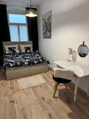 Łóżko lub łóżka w pokoju w obiekcie Apartament Chopina