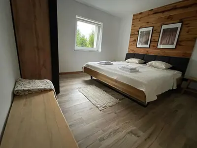 Łóżko lub łóżka w pokoju w obiekcie Stodoła 38