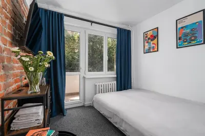 Łóżko lub łóżka w pokoju w obiekcie Patro Apartament 2 Wrocław Centrum