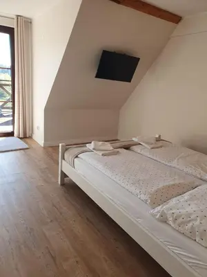 Łóżko lub łóżka w pokoju w obiekcie Nasza Jodłówka