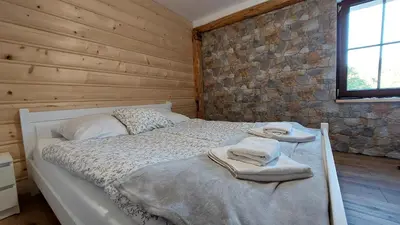 Łóżko lub łóżka w pokoju w obiekcie Nasza Jodłówka